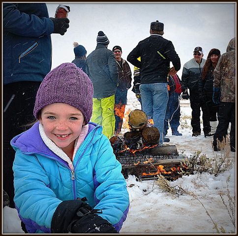 Oakly Building Snowman by the Fire. Photo by Terry Allen.