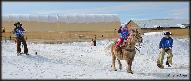 Evelyn Pulls Dad. Photo by Terry Allen.