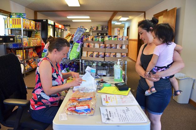 Jamie helps a customer. Photo by Terry Allen.