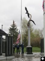 Raising the flag. Photo by Dawn Ballou, Pinedale Online.